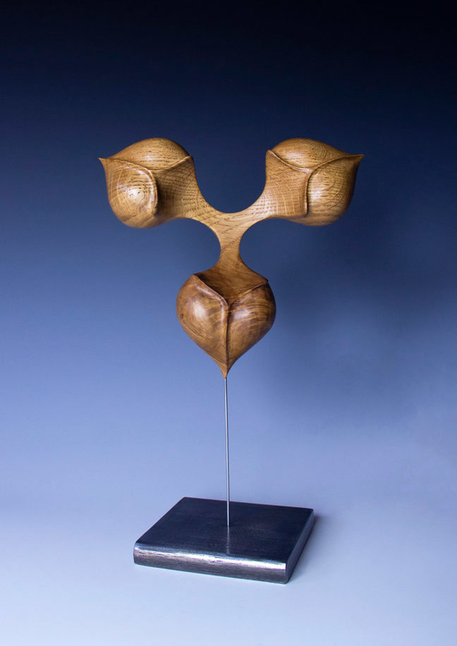 Global view of the "connection seed" in white oak on a base, original creation by Coralie Saramago